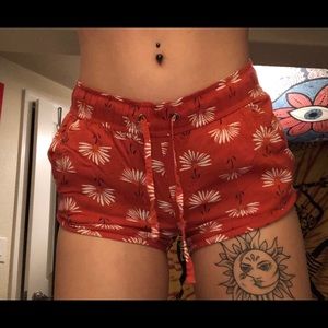 Red shorts with white daisy’s